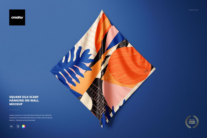 Front view of a square silk scarf mockup featuring bold geometric and leaf shapes in orange, blue, and beige tones.