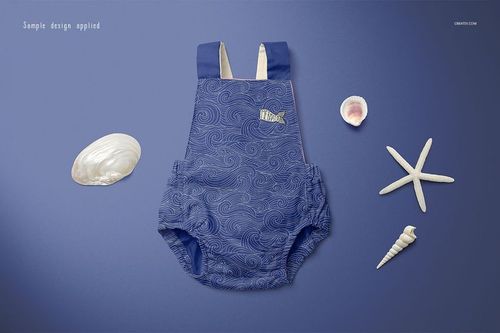 Blue baby romper mockup with swirling pattern, shown flat on a blue background alongside assorted sea shells and starfish.