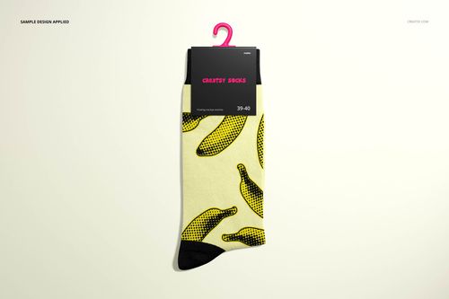 Single medium cuff sock mockup with yellow background and black banana pattern, displayed front view on hanger.