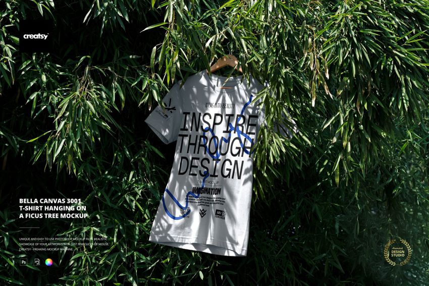 Front view of a Bella Canvas 3001 t-shirt mockup displayed on a ficus tree, with sunlight filtering through leaves.