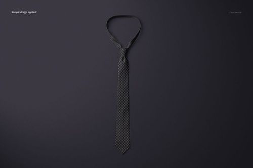 Single tie mockup featuring a subtle dotted design, arranged flat against a solid dark surface in overhead view.