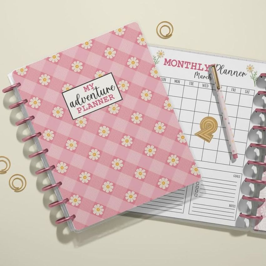 Flat lay of two spiral-bound planner mockups, featuring a closed floral cover and an open page with a calendar layout.
