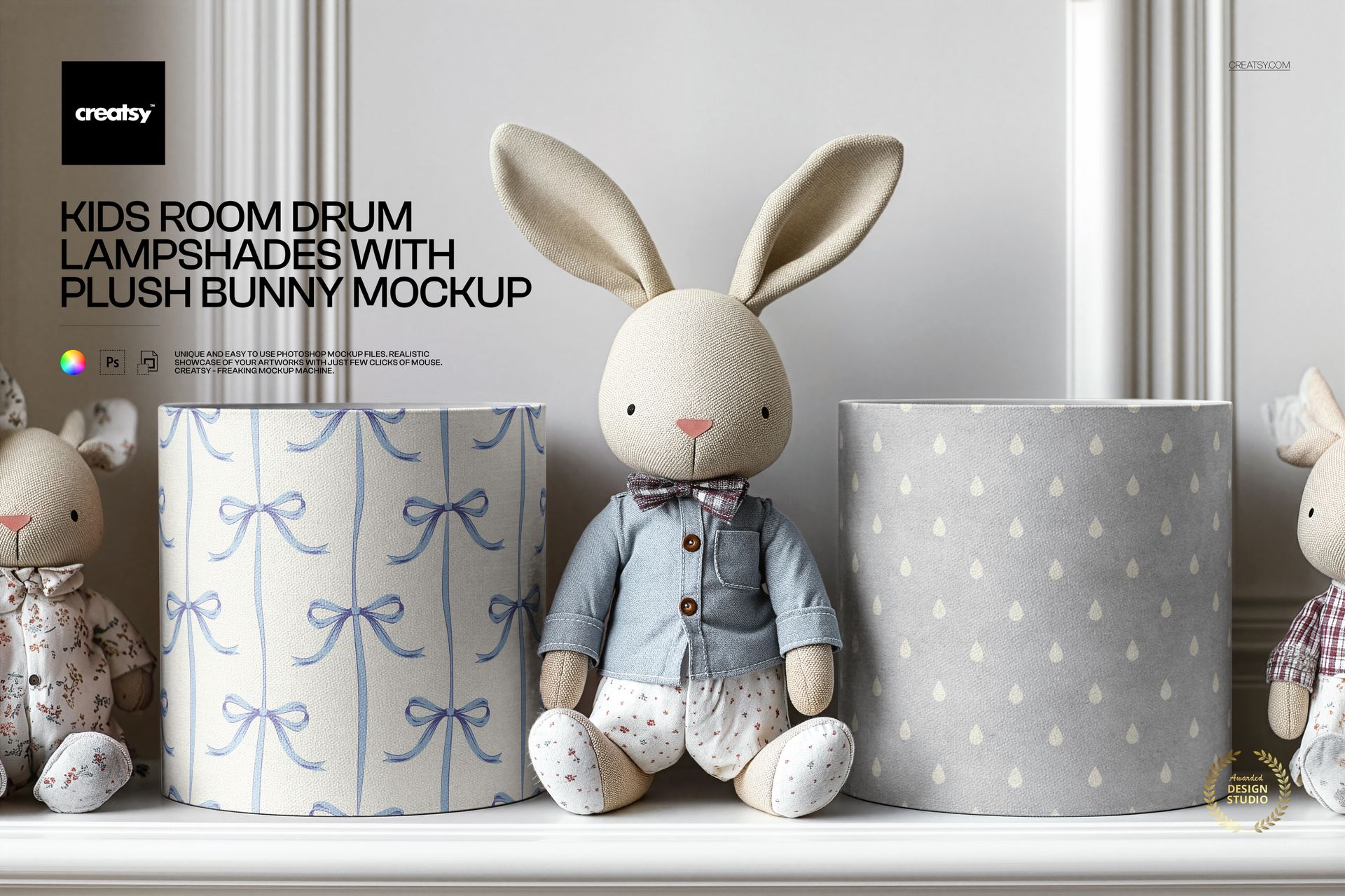 PSD mockup showing a plush bunny sitting between two cylindrical lampshades with blue bows and gray raindrop designs.