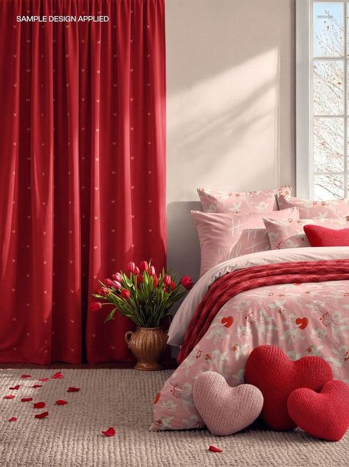 Romantic bedroom mockup with red heart-patterned curtains, pink bedding set, tulips, and heart-shaped pillows.