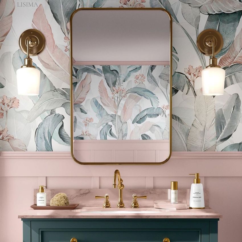 Bathroom mockup featuring a rectangular mirror, brass fixtures, and floral wallpaper with pink and green tones.