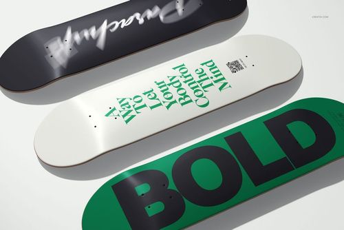 Skateboard deck mockup set with three boards shown from a top view, featuring graphic text and contrasting colors.