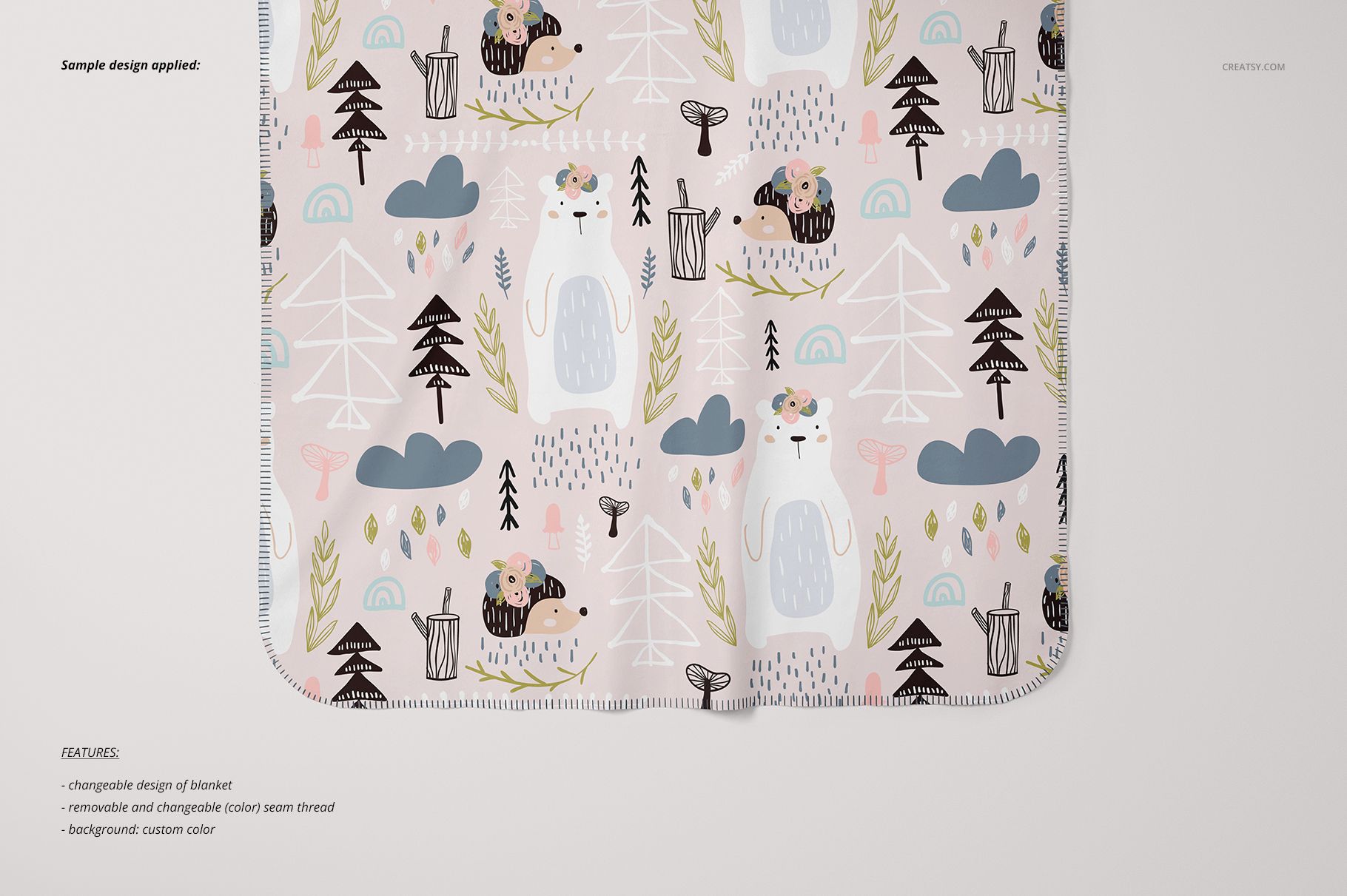 Kids blanket mockup featuring whimsical bears, trees, and clouds, displayed flat against a neutral surface.