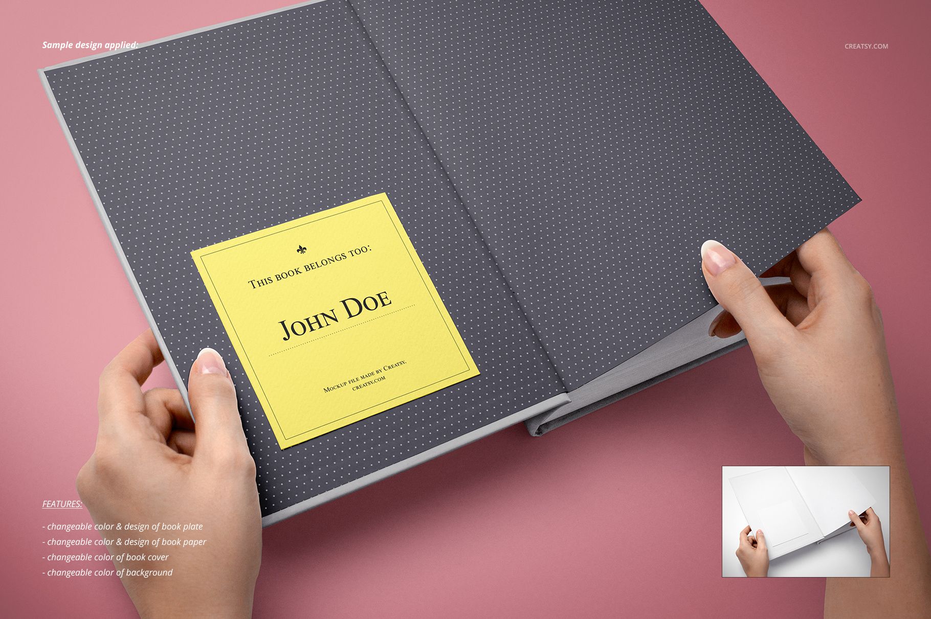 Open book with dark gray dotted endpaper and a yellow bookplate mockup, held by two hands against a neutral background.