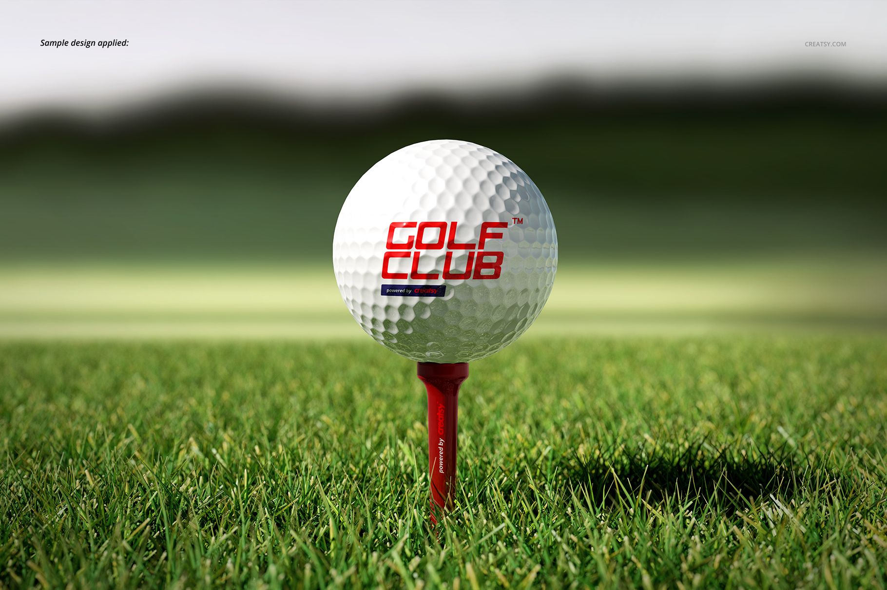 Mockup of a golf ball and tee on vibrant green grass, showing detailed texture and outdoor scenery.