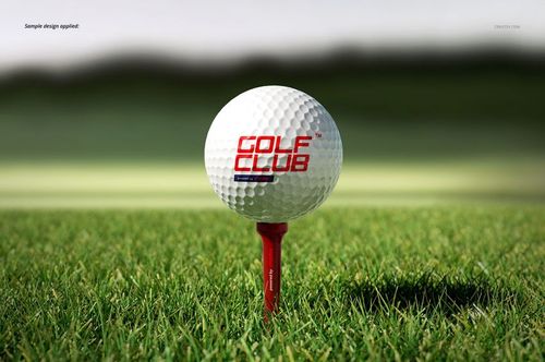 Mockup of a golf ball and tee on vibrant green grass, showing detailed texture and outdoor scenery.