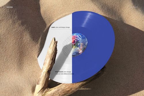 Colored vinyl record mockup displayed on sandy ground, held upright by a dry tree branch, with split color design.