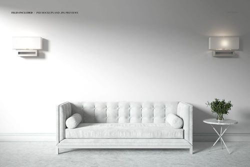 PSD mockup of a minimalist room with a light gray velvet sofa, two wall lamps, and a decorative side table.