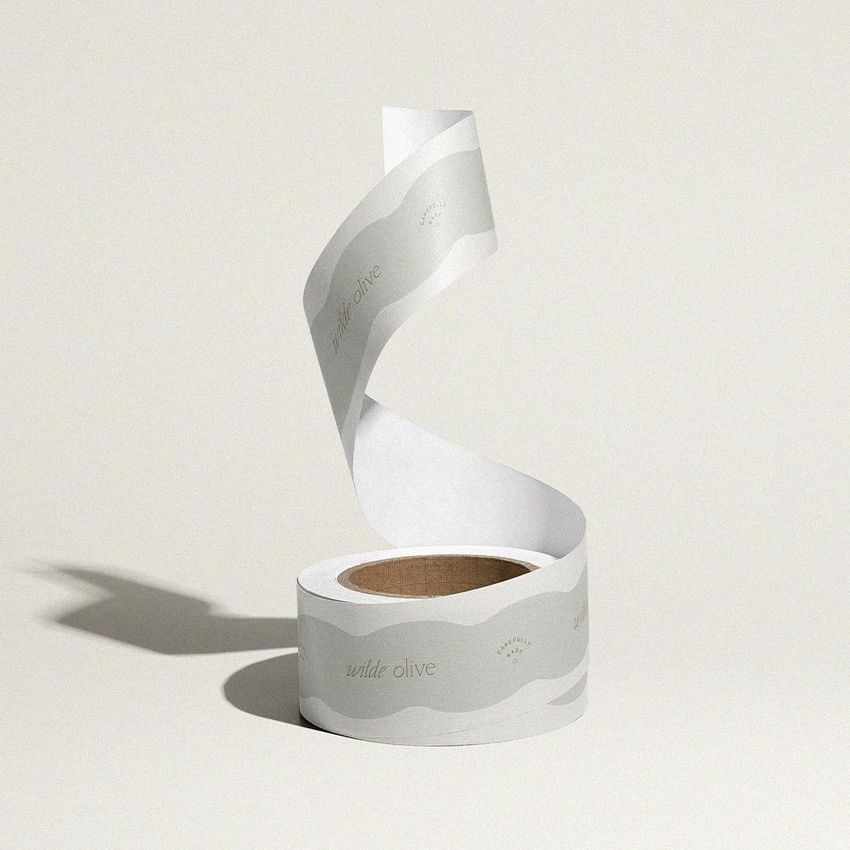 Packing tape mockup featuring a single roll with a wavy, light gray design and subtle text on a neutral background.