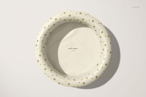 Round inflatable kids pool mockup shown from above, featuring a white base and scattered green leaf accents.