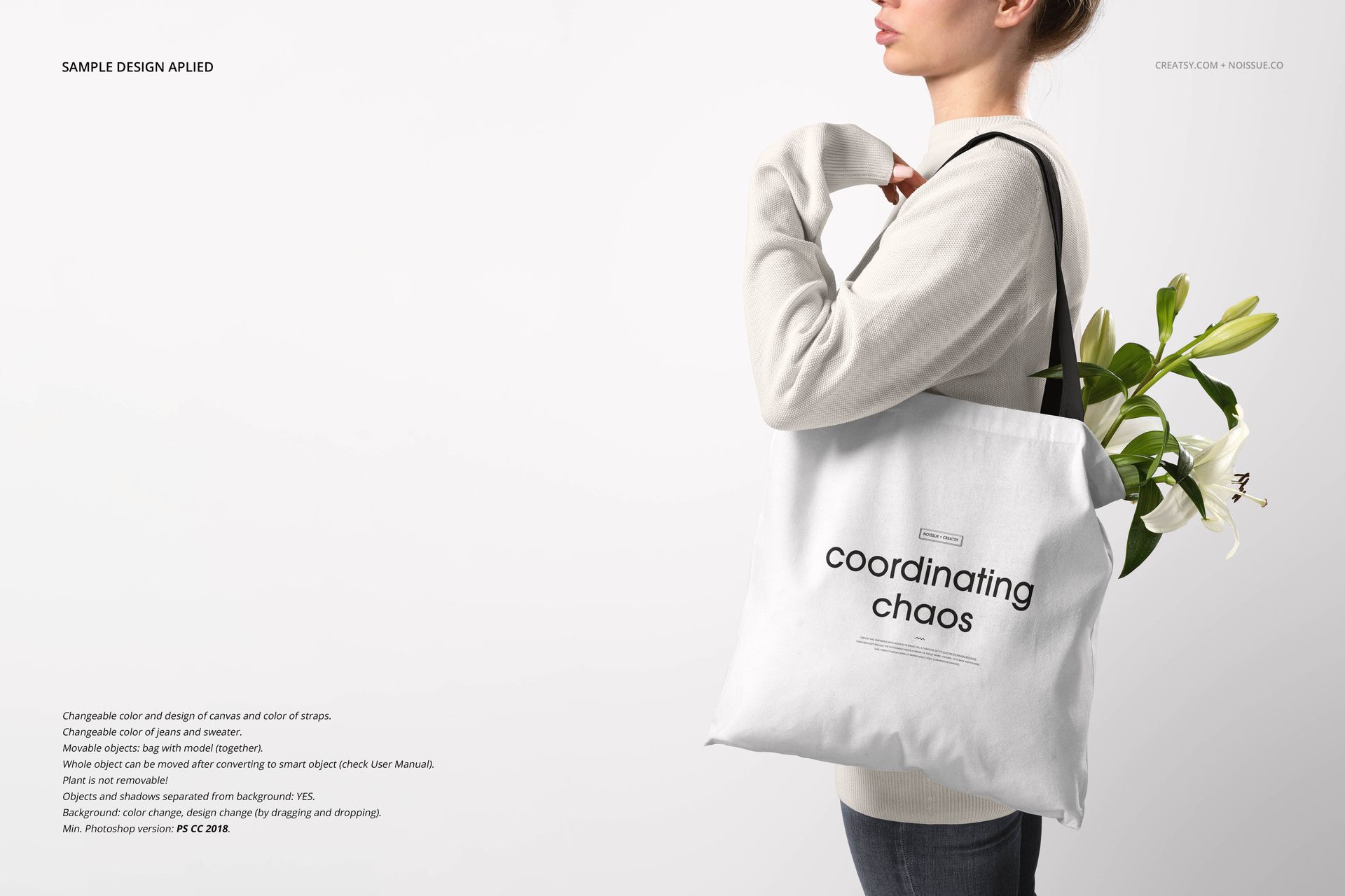 Mockup of a white tote bag with black lettering, held by a woman in casual clothing, flowers peeking out of the bag.