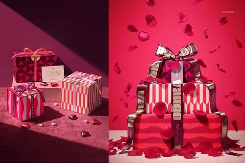 Valentine's Day themed packaging mockup featuring wrapped boxes in red and pink, surrounded by rose petals.