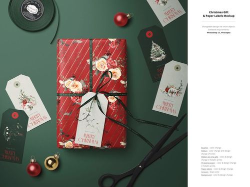 Holiday PSD mockup featuring a decorated gift box, assorted Christmas tags, baubles, scissors, and ribbon spool.