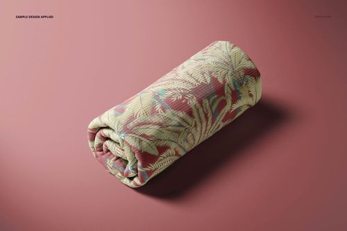 Rolled rib knit fabric mockup with a tropical leaf pattern in green and beige on a muted pink background, front view.