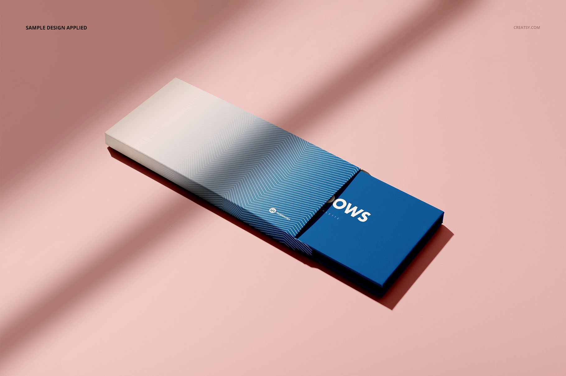 Eyeshadow palette mockup featuring a sleek rectangular case with blue and white gradient design on a pink background.