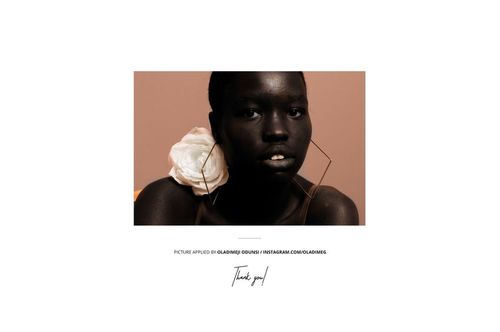 Front view of an 8.5x11 magazine mockup featuring a geometric earring and a large white flower on a neutral background.