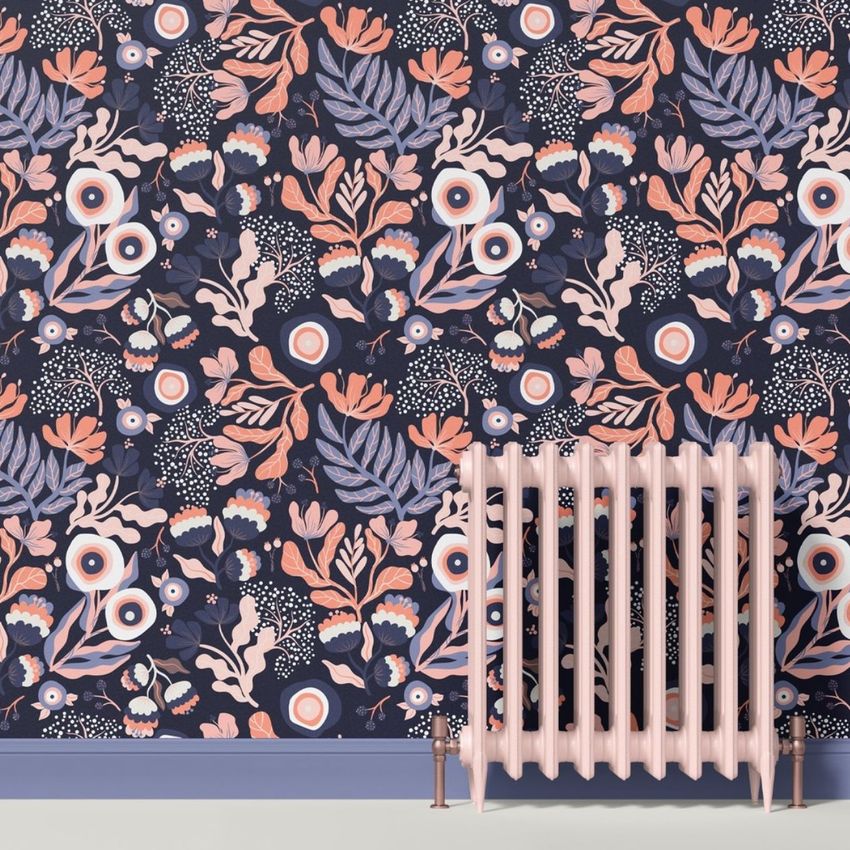 Paper wallpaper mockup showing a modern floral pattern in soft pink and blue tones, with a pastel radiator in the foreground.