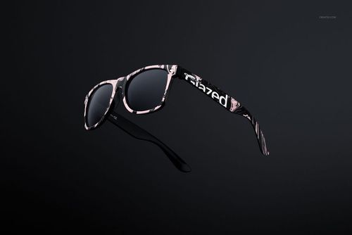 Front view of custom printed sunglasses mockup with a black frame and abstract pink and white pattern on a dark background.