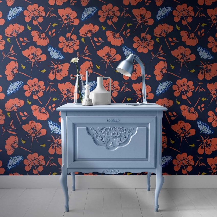 Interior scene mockup featuring a light blue vintage cabinet with a lamp and vases, set against a dark floral wallpaper.