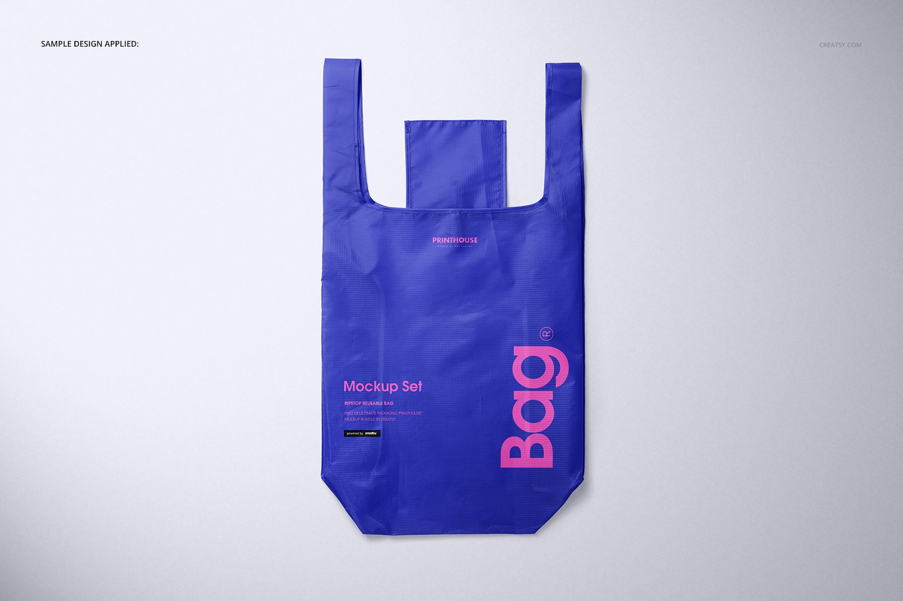 Blue ripstop reusable bag mockup shown flat with handles extended, featuring bold pink lettering on the front.