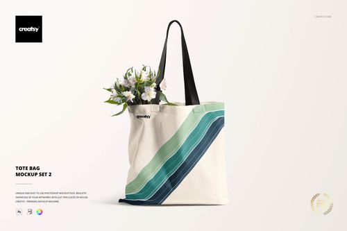 Tote bag mockup with black straps, decorated with wavy green and blue lines, shown upright with flowers inside.