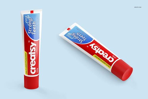 Toothpaste tube mockup set featuring two tubes with bold red, blue, and white design on a clean blue surface.