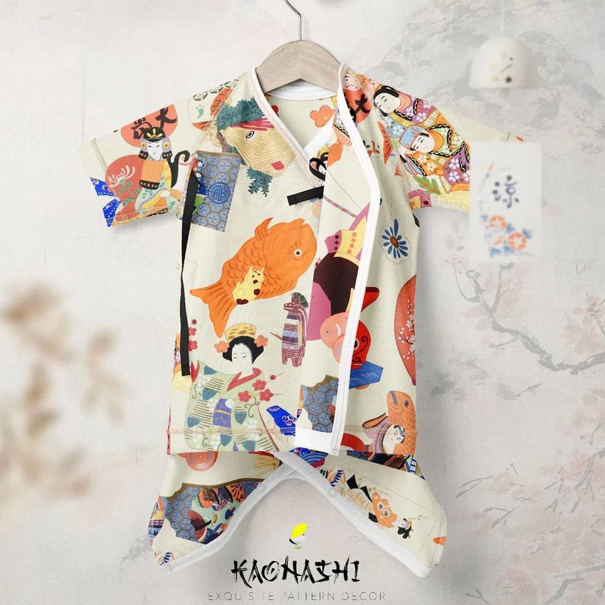 Baby kimono bodysuit mockup with colorful Japanese-inspired illustrations, displayed on a hanger against a light wall.