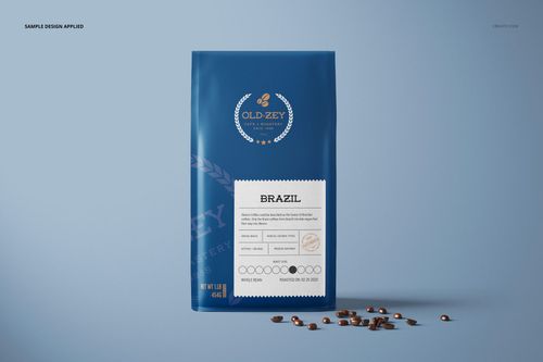 Blue paper coffee bag mockup shown from the front, featuring a sample design and scattered coffee beans on the right.