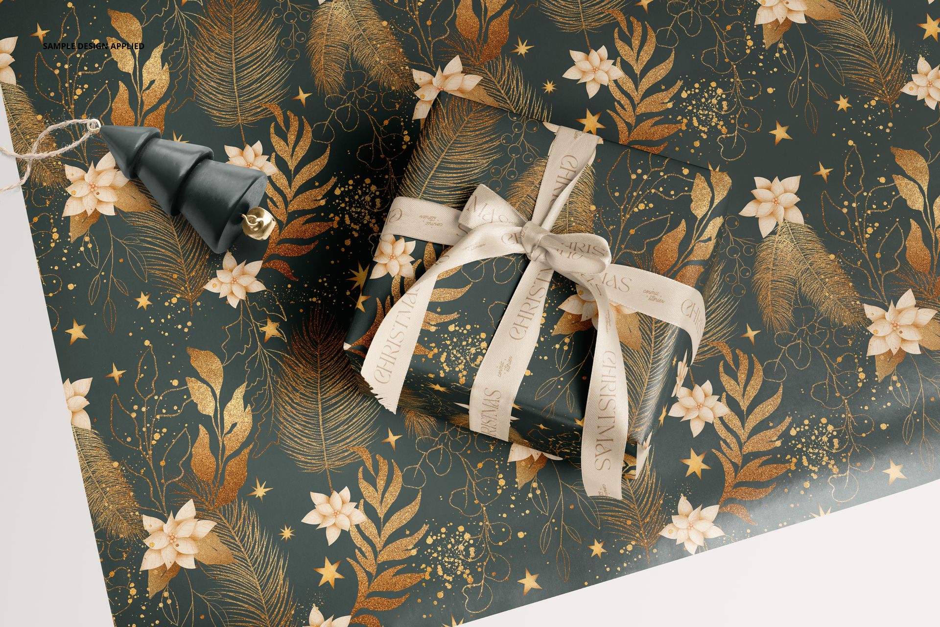 Elegant wrapping paper mockup with gold botanical pattern and white floral accents, gift box and ribbon included.