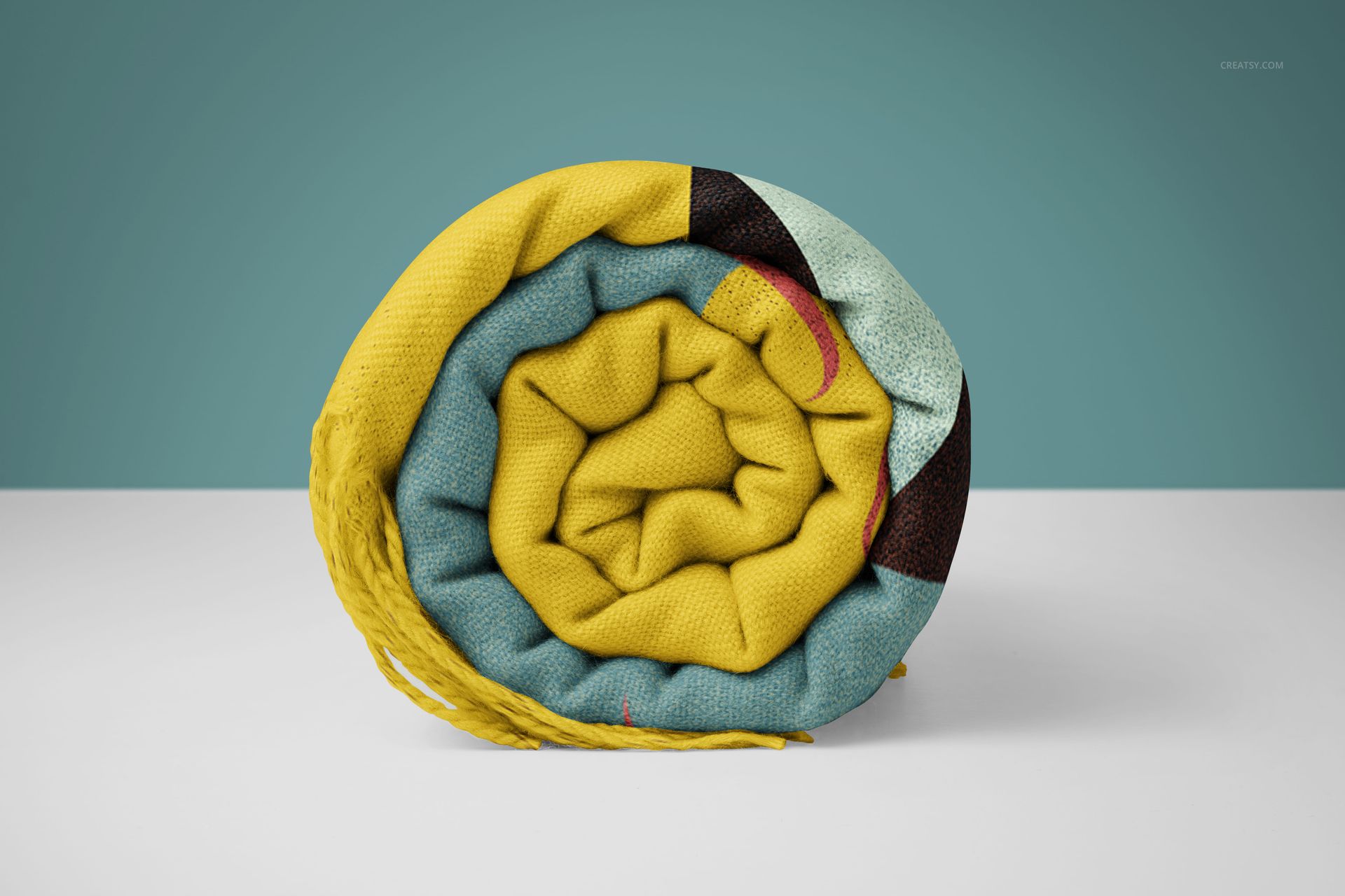 Tassel fringe blanket mockup in PSD format, rolled up to reveal textured fabric and multicolor design elements.