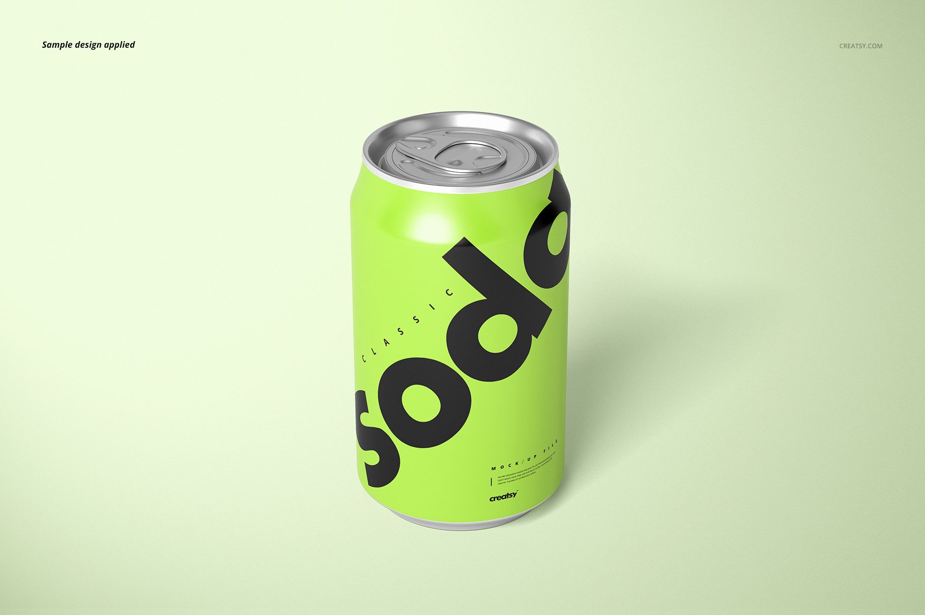 Front view of a soda can mockup with a vivid green design and large black lettering, placed on a pale green surface.