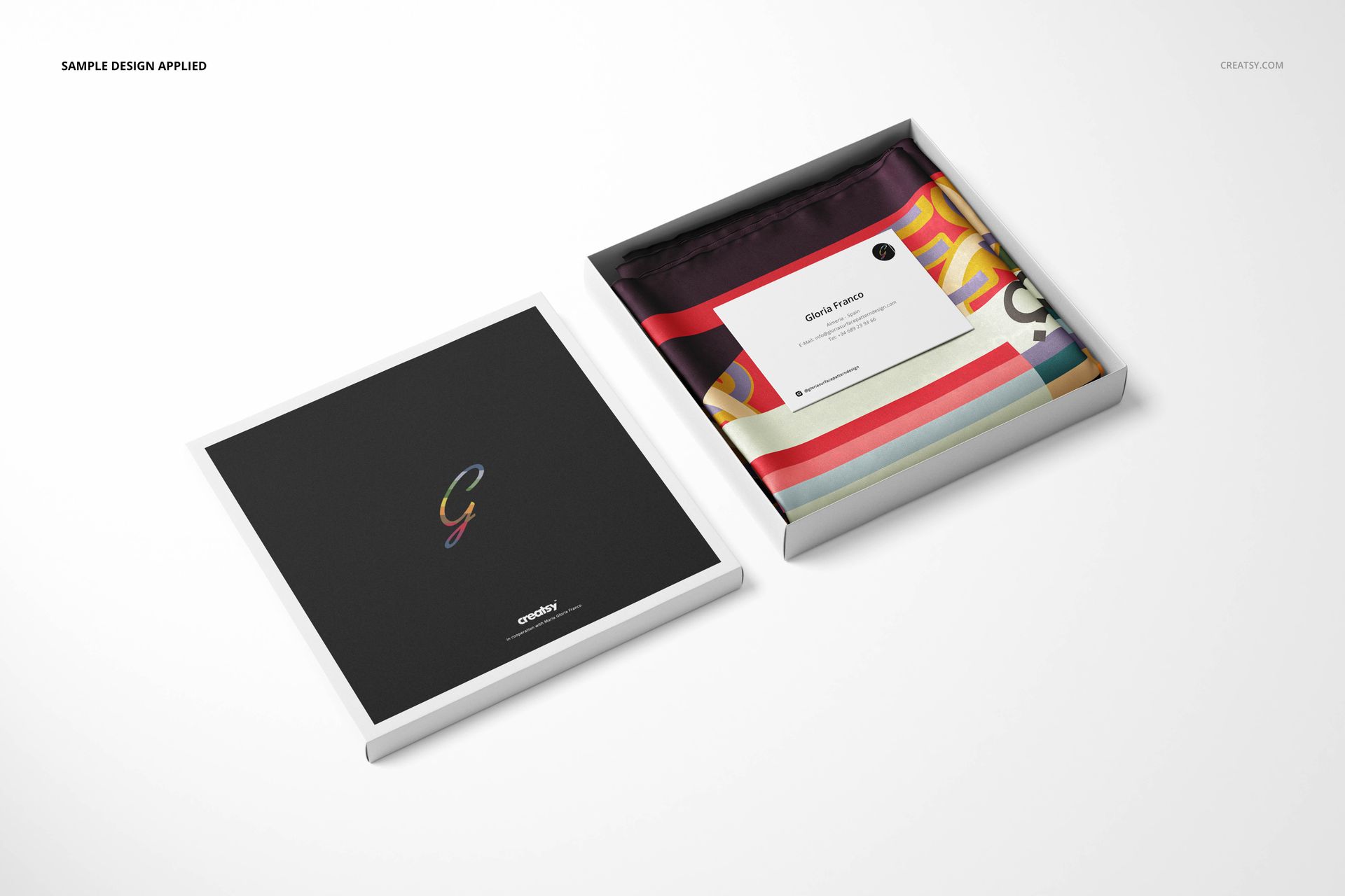 Twill silk scarf mockup set showing a scarf with vibrant stripes and shapes, presented in a square box with a card.