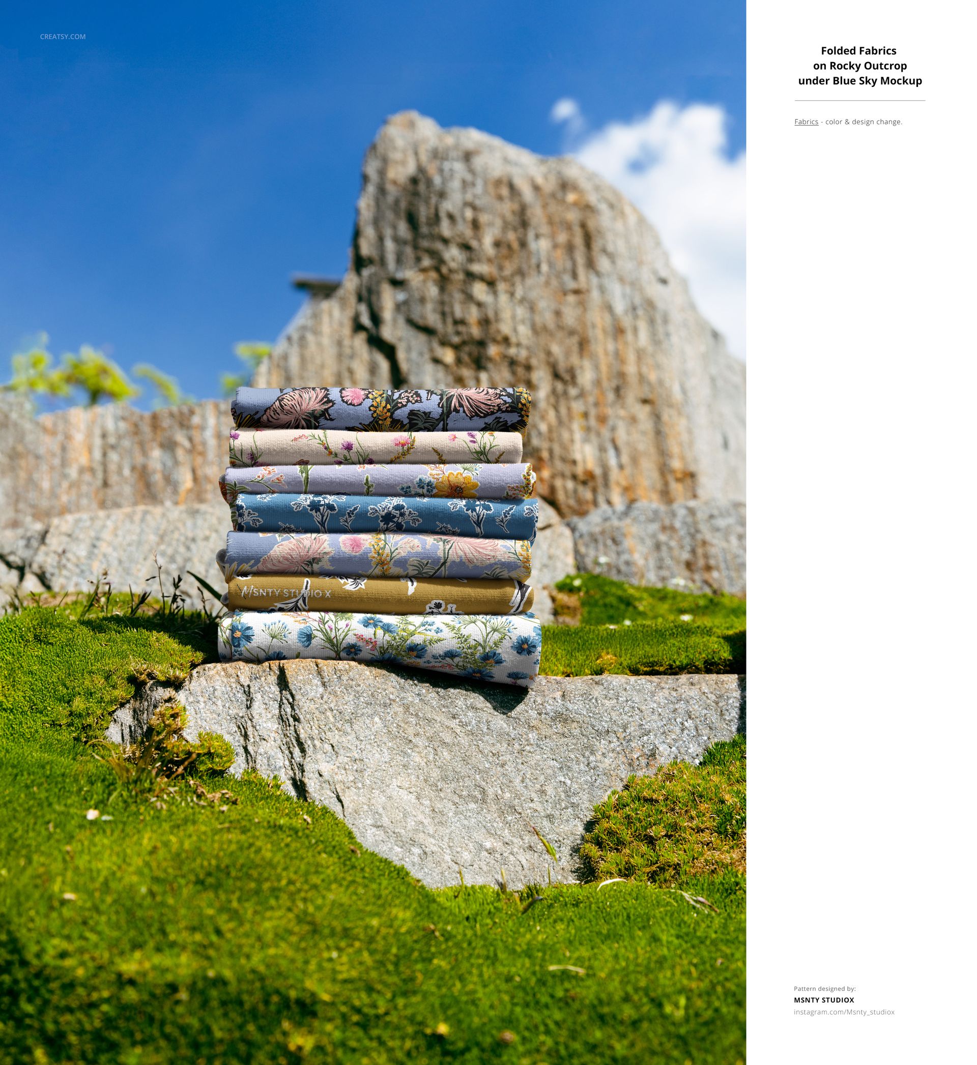 Folded fabric mockups featuring colorful floral designs, arranged on stone surfaces with greenery in an outdoor setting.