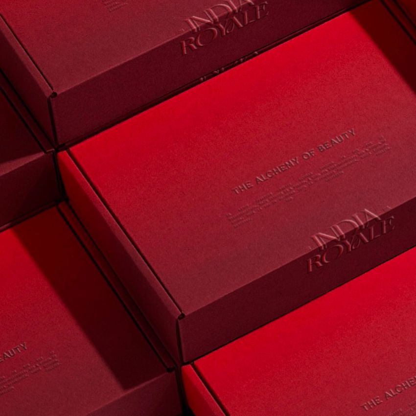 Red mailing box mockup set arranged in a diagonal pattern, featuring embossed text on the lids and a soft shadow effect.