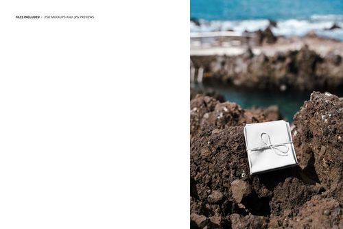 Fabric mockup with twine placed on textured volcanic rocks, ocean and sky visible in the background.