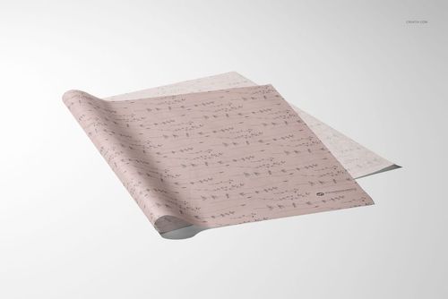 Two sheets of tissue paper with subtle patterns, displayed at an angle on a light gray surface in a mockup scene.