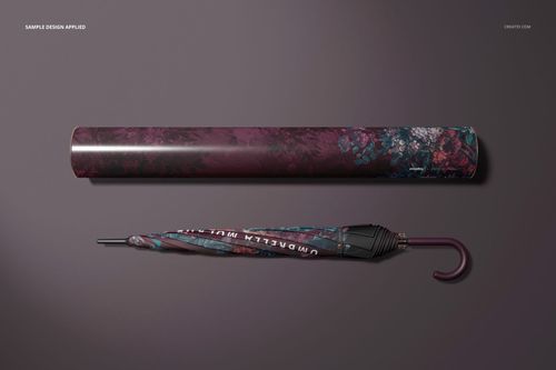 Umbrella and packaging tube mockup featuring a dark floral design, displayed in a top-down view on a neutral background.