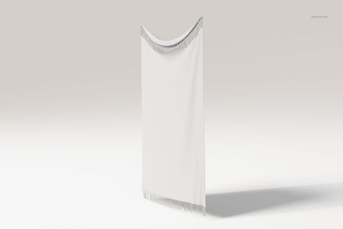 Fringed tapestry blanket in white displayed upright, featuring a subtle fringe detail along the top and bottom edges.