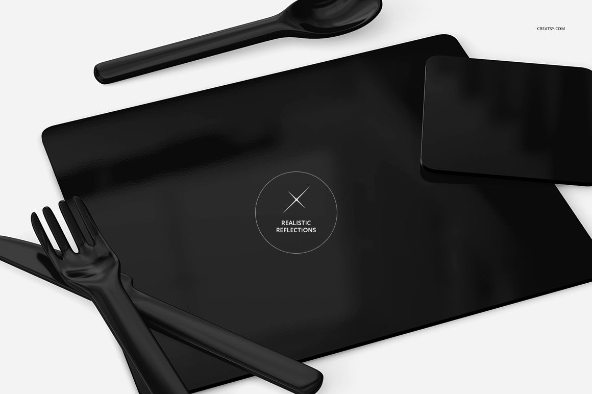 Black placemat and coaster set mockup displayed on a light surface with matching black cutlery and spoon, top view.
