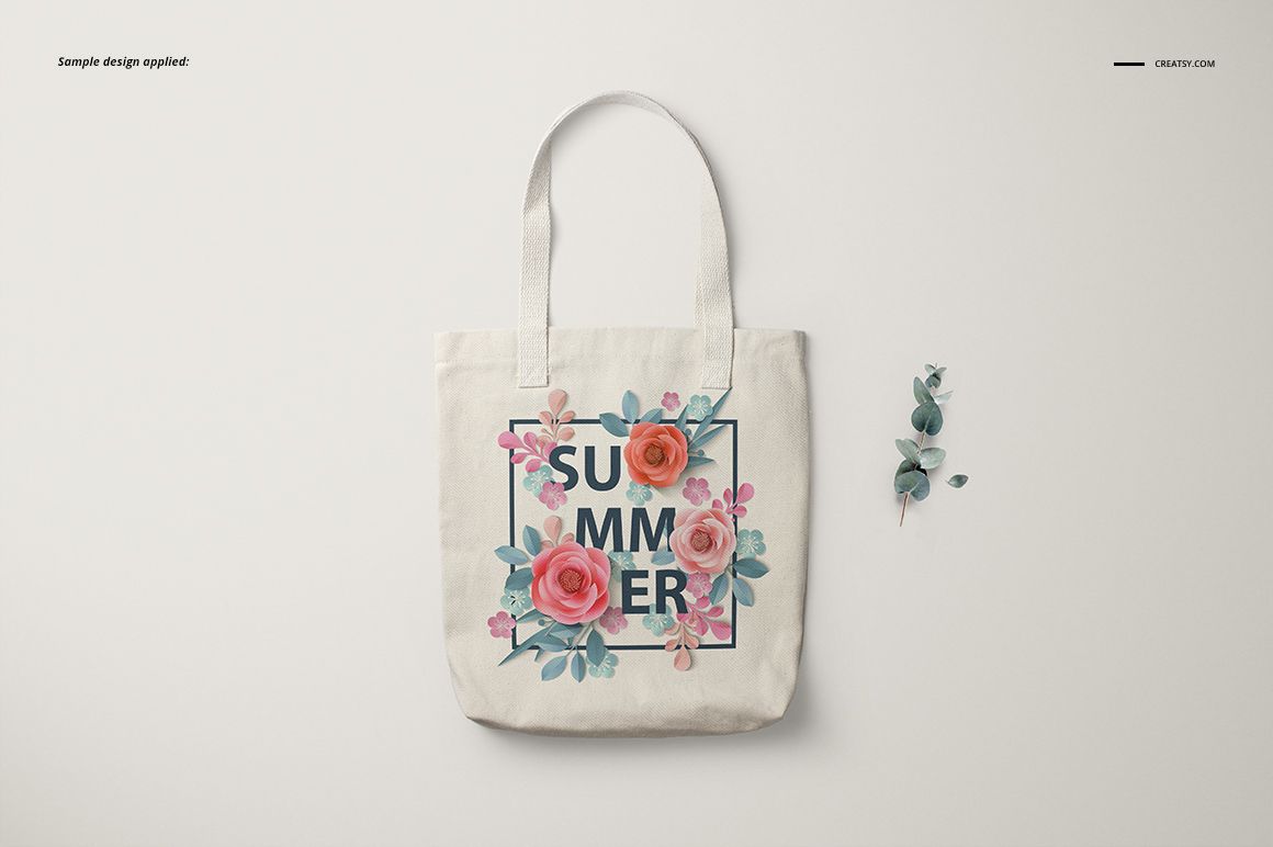 Front view of a polyester tote bag mockup with white fabric, floral design, and 'SUMMER' text on a light background.