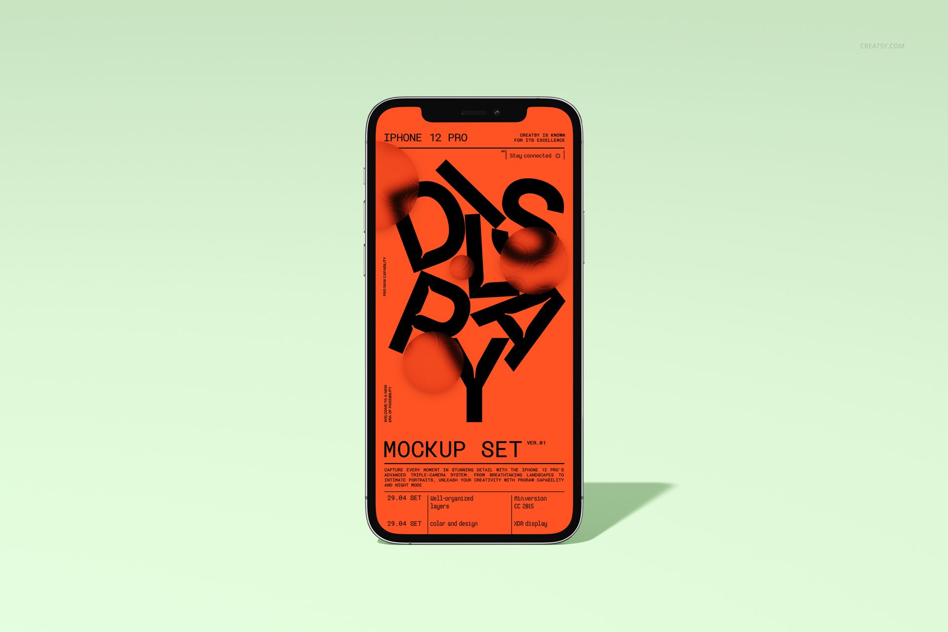 iPhone 12 Pro mockup standing upright, screen featuring an orange and black design, minimal background setting.
