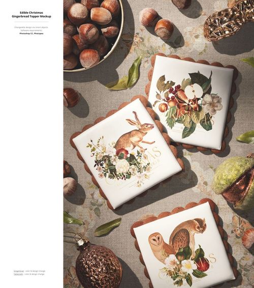 Square cookies with white icing and holiday artwork, arranged with nuts on a textured tablecloth, PSD mockup scene.