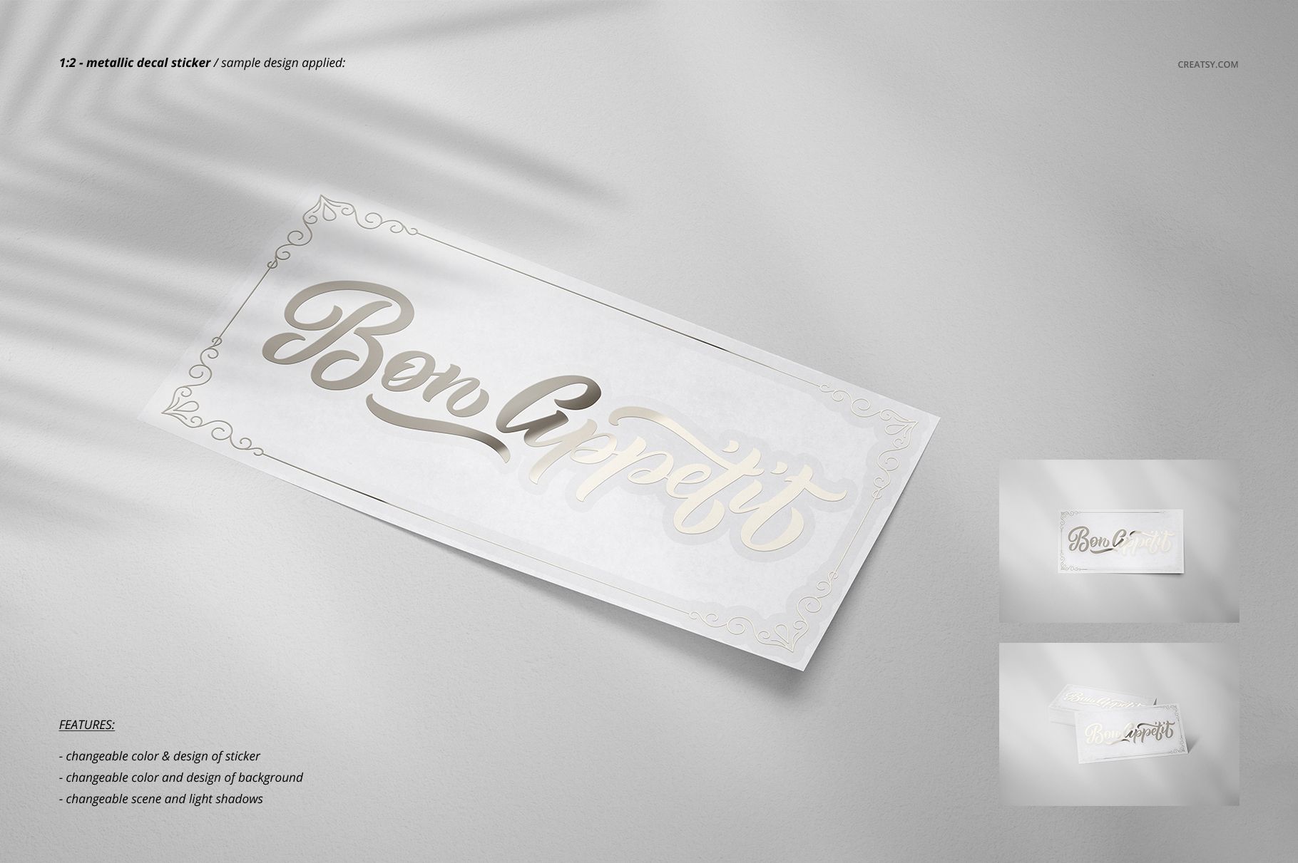 Rectangular decal sticker with metallic script text on a white background, shown in a stationery mockup scene with soft shadows.