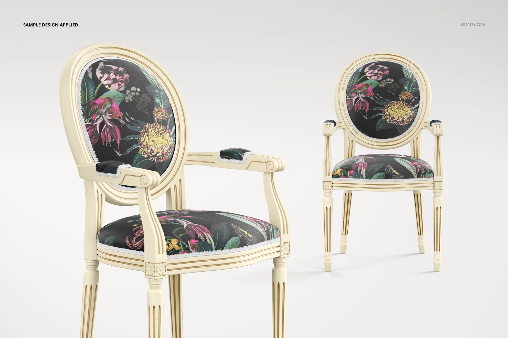 Front view of two medallion back armchairs with cream frames and floral patterned upholstery in a living room mockup.