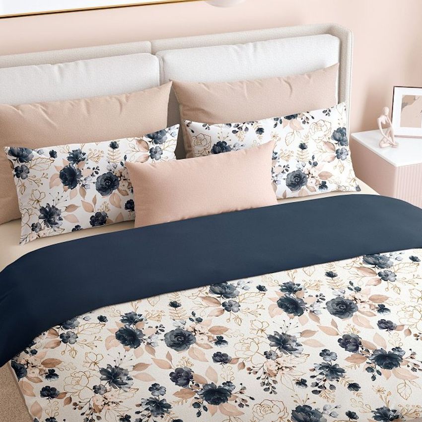 Bedroom scene bedding mockup featuring a neatly made bed with floral patterned duvet and pillows in soft neutral tones.