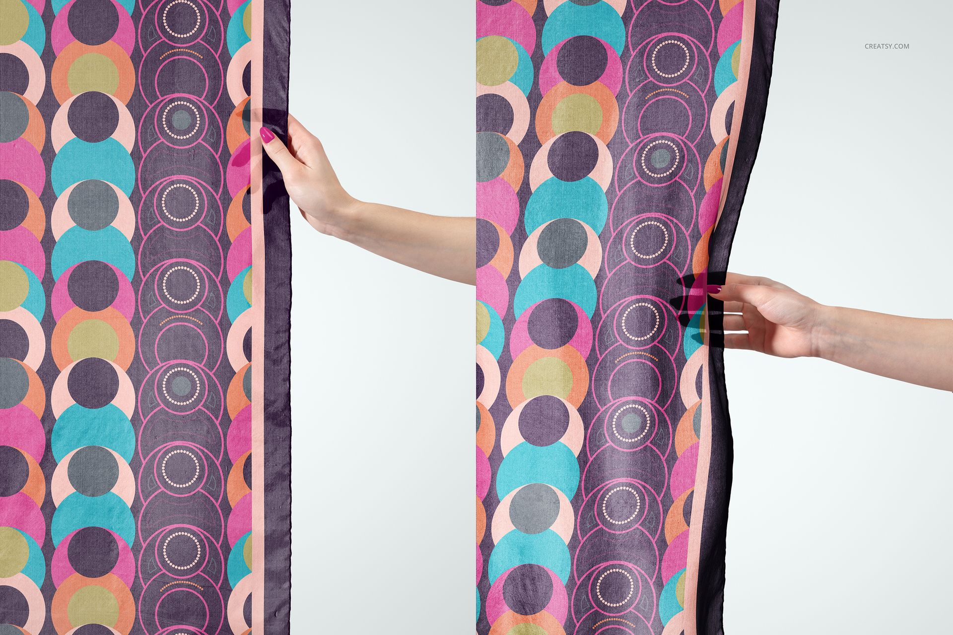 Colorful patterned silk scarf mockup held vertically by two hands, displaying pink, purple, blue, and orange circles.